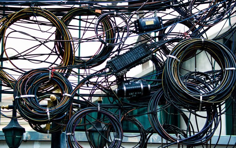 A knot of tangled cables, all going to the same place