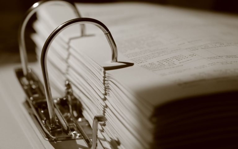 Files stacked past the point anyone will read them