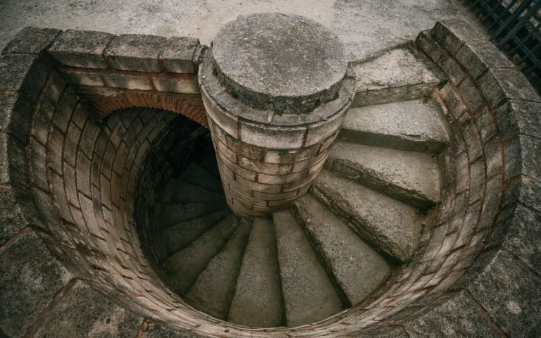 A spiral staircase seen from above, turning once per record