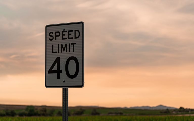 A speed limit sign on an open road