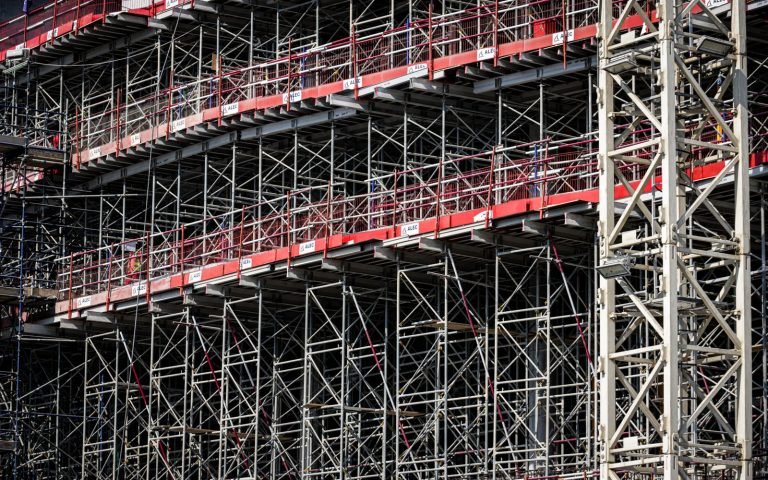 Scaffolding on an unfinished building: work pending before the callout