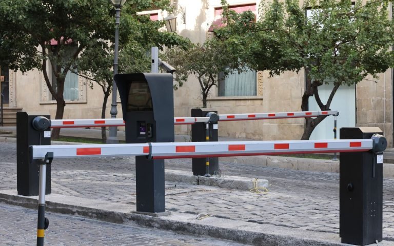 A barrier arm down across the road until the record passes inspection