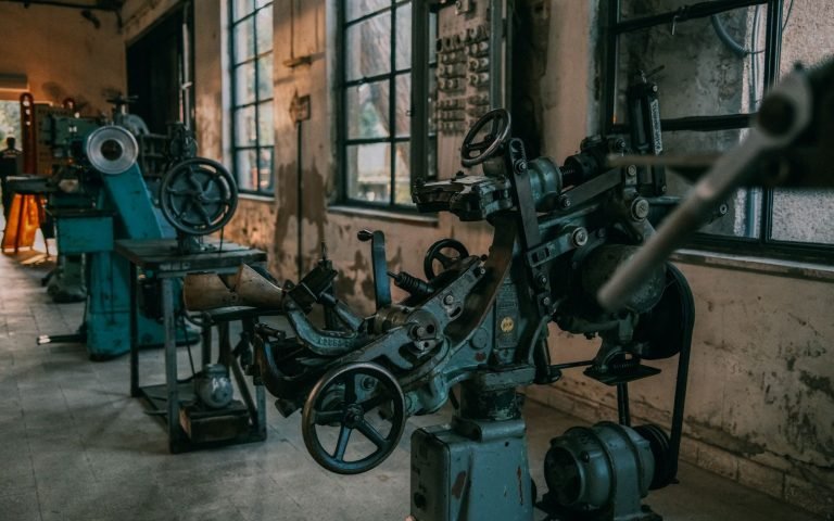 Retired factory machinery, still turning, waiting to be replaced
