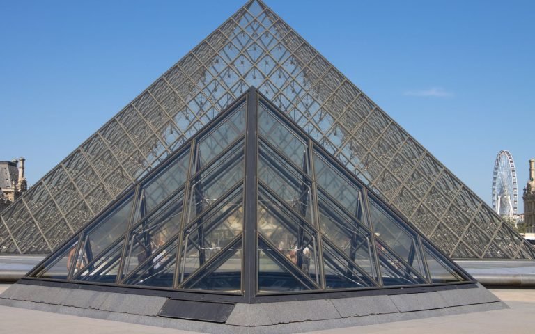 A stepped pyramid seen from below, each tier resting on the one beneath it