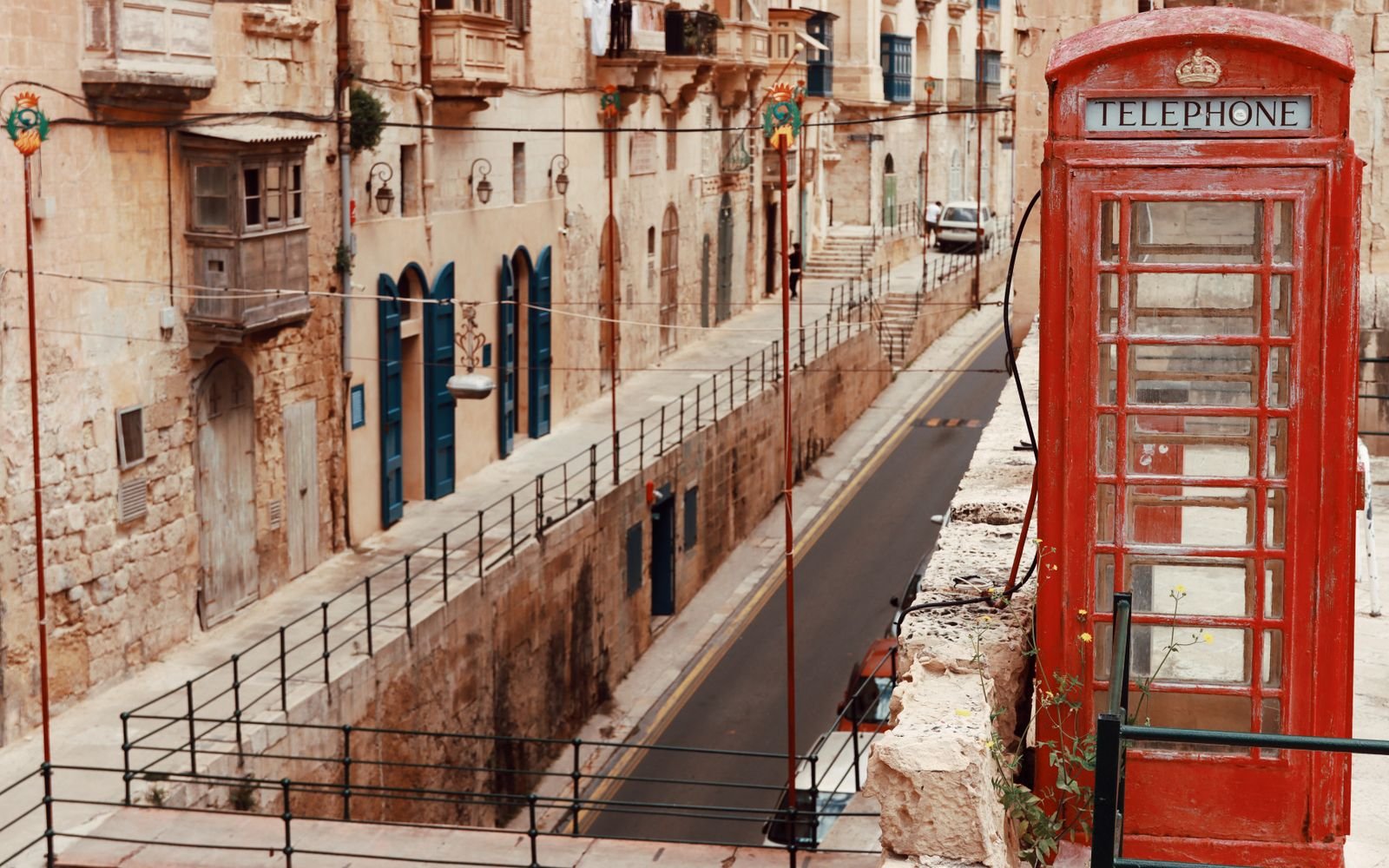 A telephone box on a street corner: the way in
