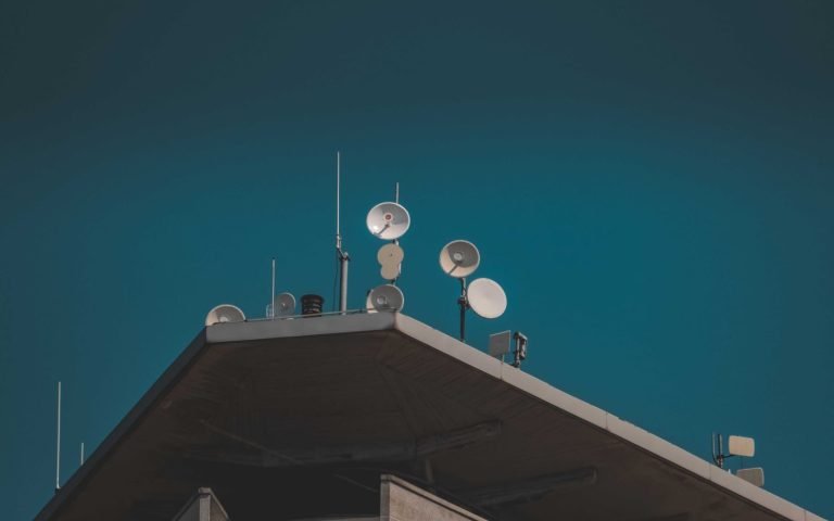 A satellite dish pointed off-frame, the shape of an outbound callout