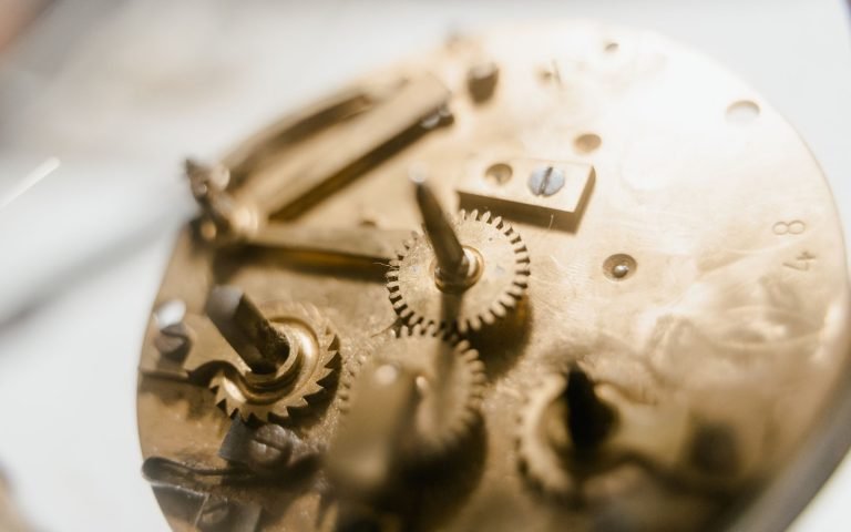 The gear train inside a clock, where a scheduled path waits