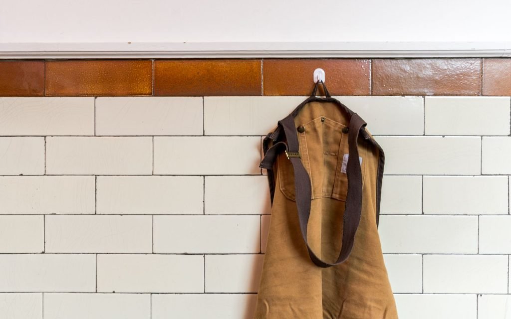 A uniform on a hook: whose permissions the flow wears