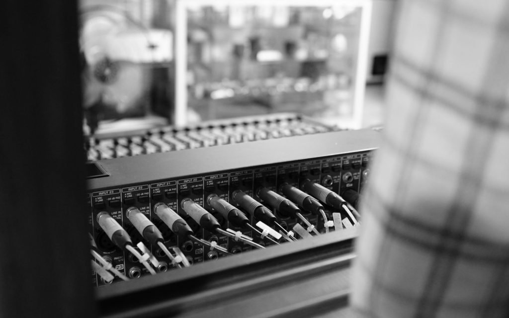 A patch bay of cables joining separate machines, which is the job a protocol does