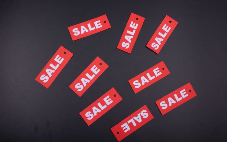 A price only exists on a tag, and a tag belongs to one stall